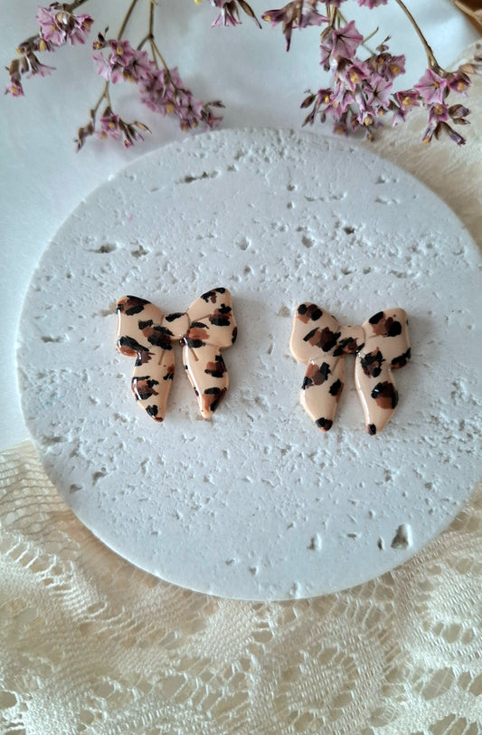 Boucles d’oreilles nœuds léopard