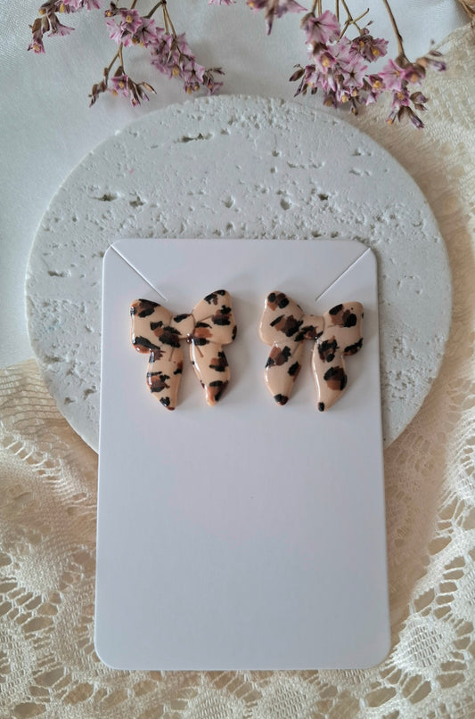 Boucles d’oreilles nœuds léopard